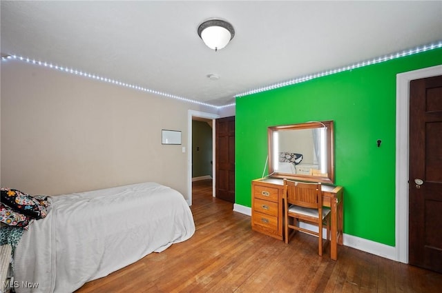 bedroom featuring hardwood / wood-style floors