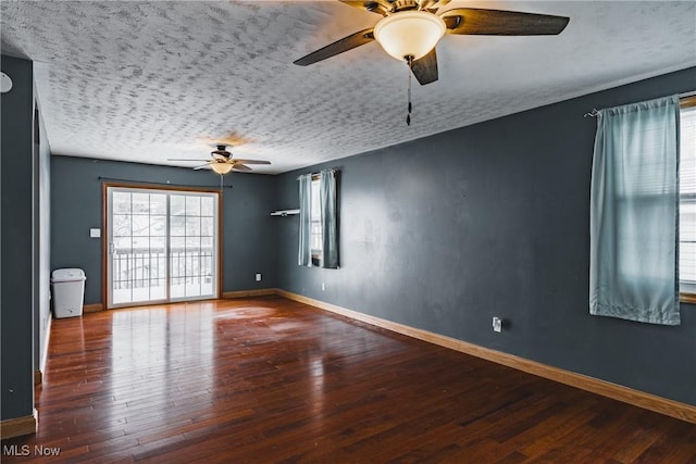 empty room featuring hardwood / wood-style floors, a textured ceiling, and ceiling fan