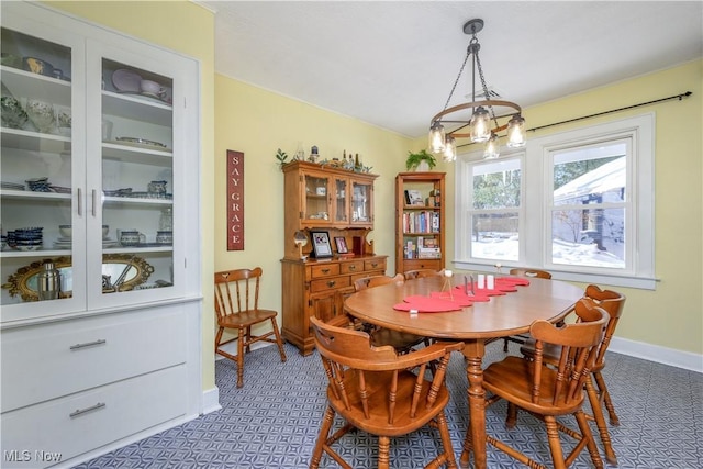 dining room featuring a notable chandelier