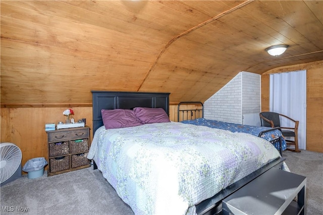 bedroom with carpet floors, vaulted ceiling, wood ceiling, and wooden walls