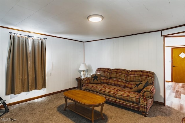 carpeted living room with ornamental molding