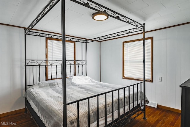 bedroom featuring dark hardwood / wood-style floors