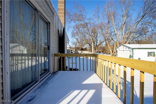 view of snow covered deck