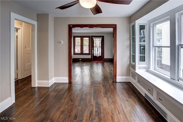 interior space featuring french doors, ceiling fan, and dark hardwood / wood-style floors