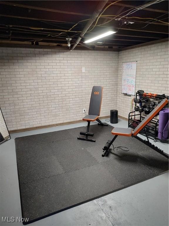 workout area with brick wall