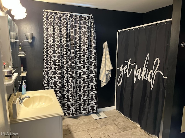 bathroom with vanity and tile patterned flooring