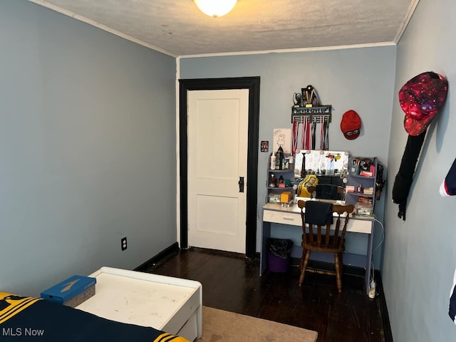 bedroom with a textured ceiling, dark hardwood / wood-style floors, and crown molding