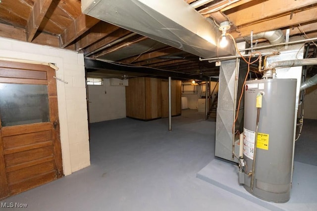 basement featuring gas water heater