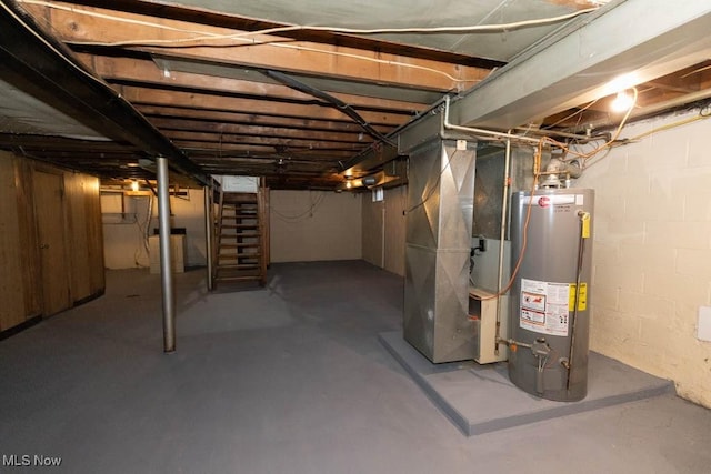 basement featuring heating unit and gas water heater