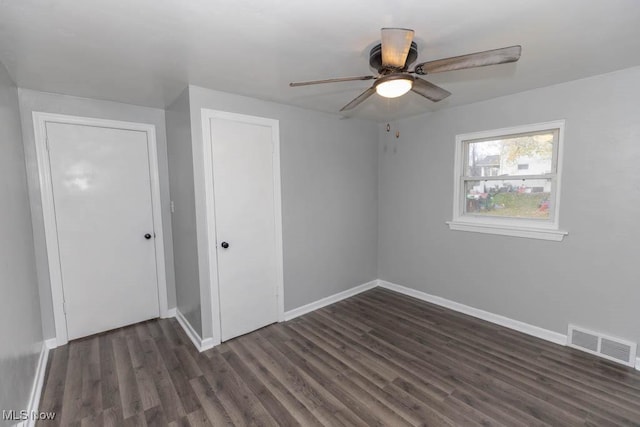 additional living space with dark hardwood / wood-style floors and ceiling fan