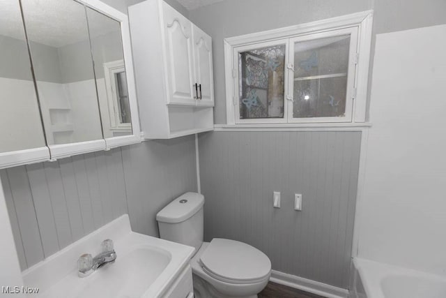 bathroom featuring sink and toilet