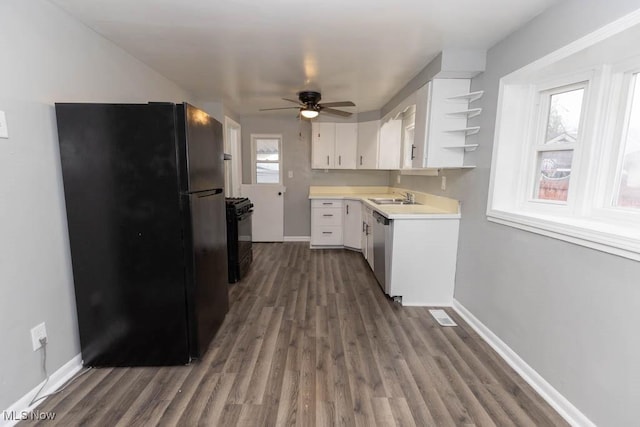 kitchen featuring dark hardwood / wood-style floors, sink, white cabinets, ceiling fan, and black appliances