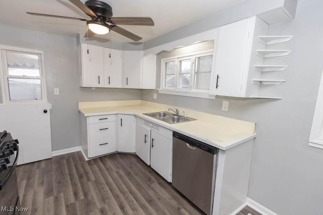 kitchen with dark wood-type flooring, sink, dishwasher, gas range oven, and white cabinets