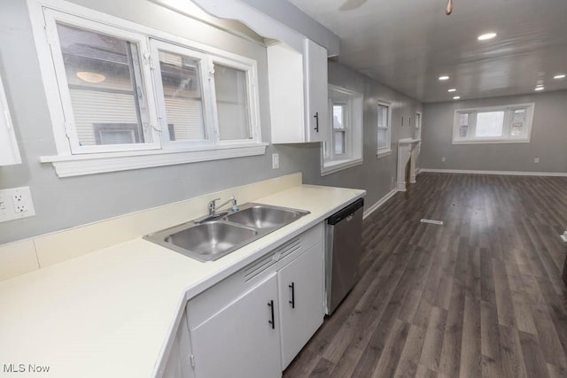 kitchen featuring white cabinetry, dark hardwood / wood-style flooring, dishwasher, and sink