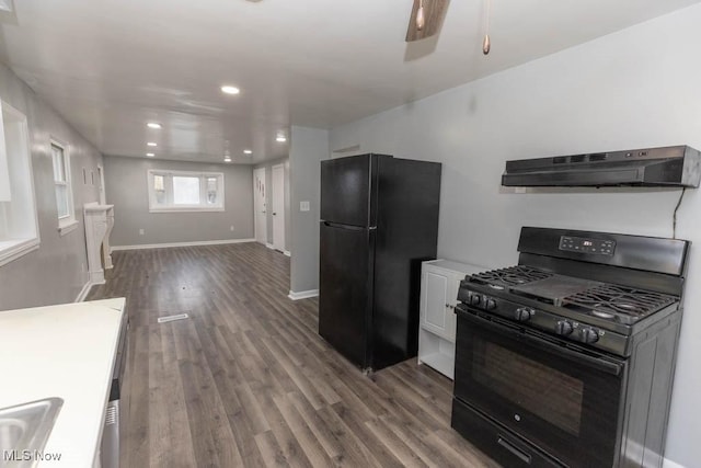 kitchen featuring ceiling fan, white cabinets, wood-type flooring, and black appliances