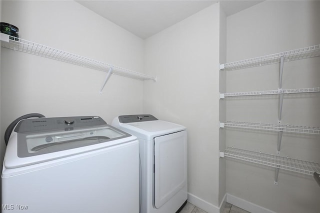 laundry room with separate washer and dryer