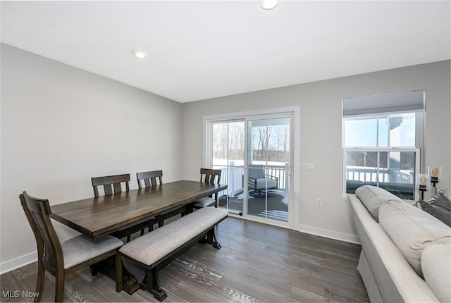 dining room with dark wood-type flooring