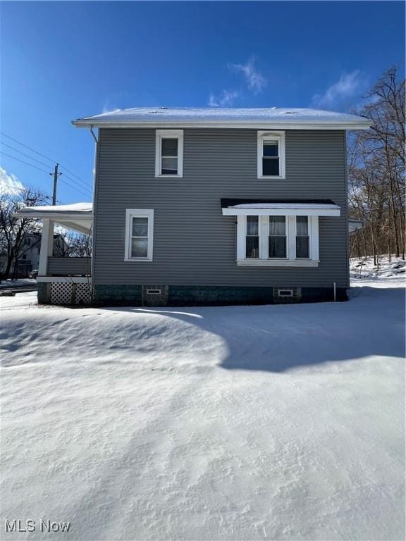 view of snow covered property