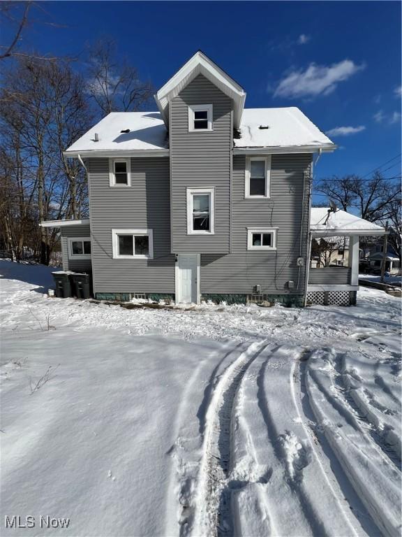 view of snow covered house