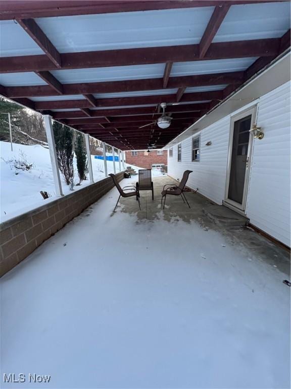 snow covered patio with ceiling fan