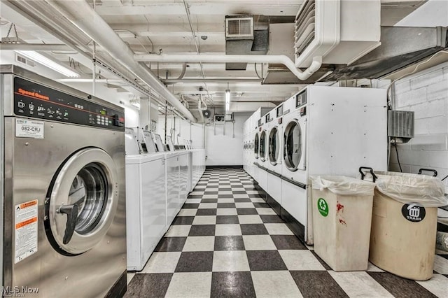 clothes washing area featuring independent washer and dryer