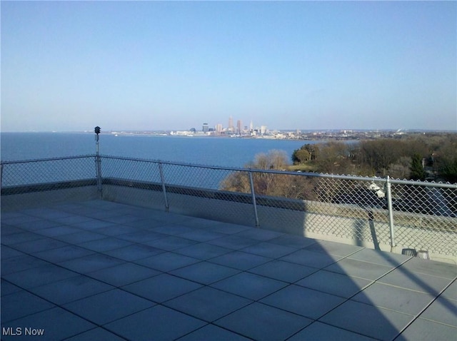 view of patio with a water view