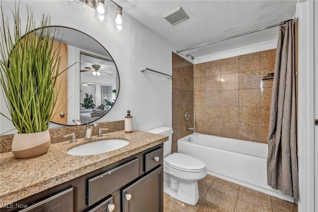 full bathroom featuring toilet, ceiling fan, shower / bath combo, a textured ceiling, and vanity