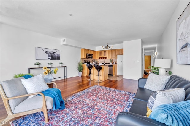 living room with dark hardwood / wood-style floors