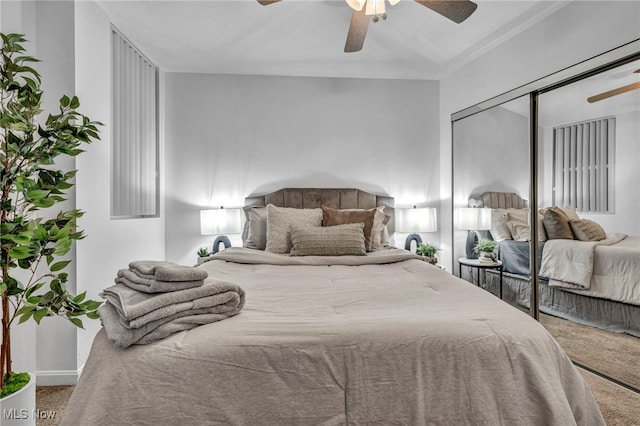 bedroom with a closet, carpet flooring, and ceiling fan