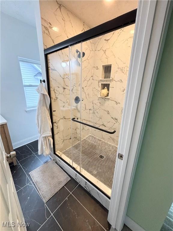 bathroom featuring an enclosed shower