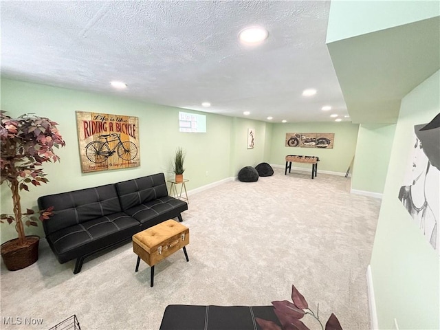 carpeted living room featuring a textured ceiling