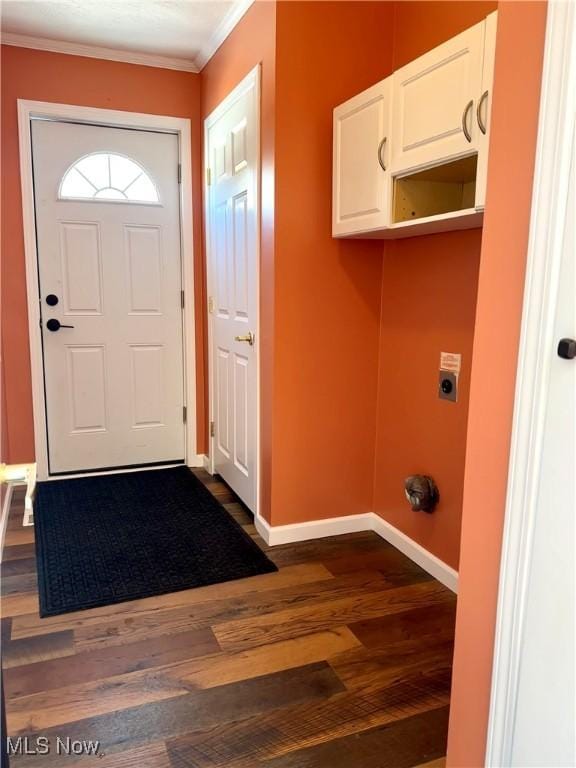 doorway to outside featuring dark wood-type flooring and ornamental molding