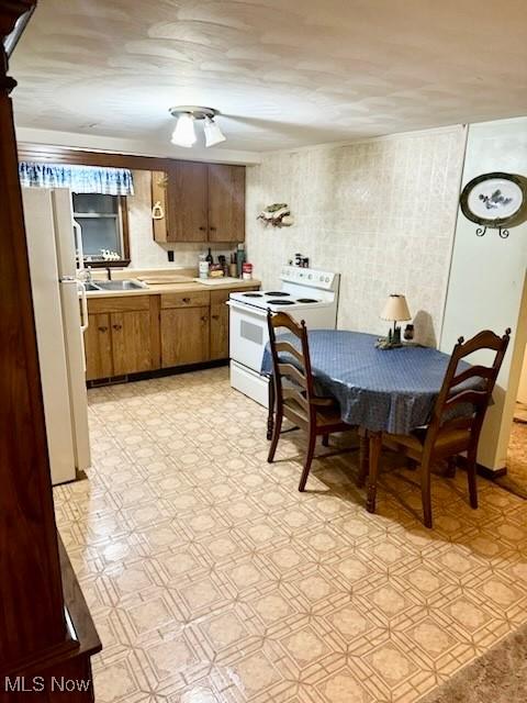 kitchen featuring sink and white appliances