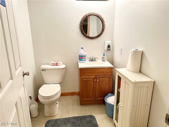 bathroom featuring toilet and vanity