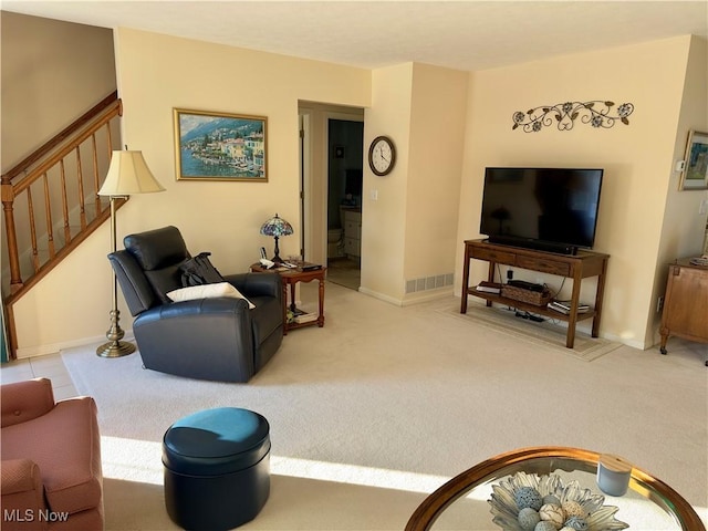 living room with light colored carpet