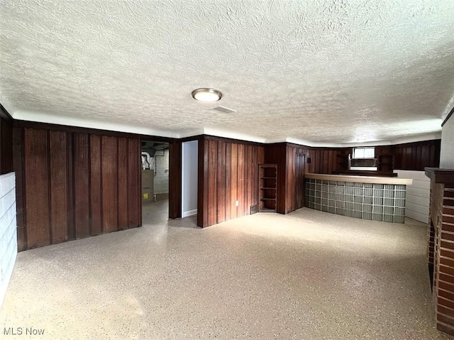 basement with a textured ceiling