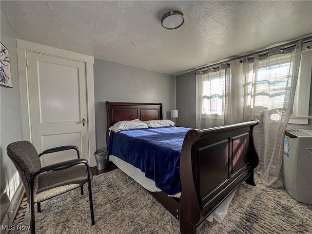 bedroom featuring a textured ceiling