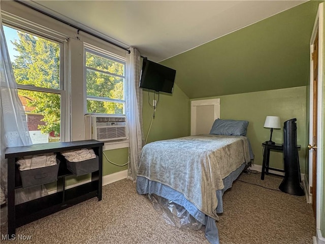 carpeted bedroom with vaulted ceiling and cooling unit