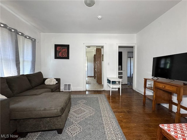 living room featuring dark hardwood / wood-style flooring