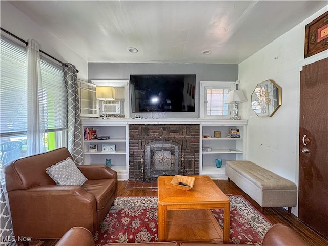 living room featuring a fireplace and hardwood / wood-style flooring