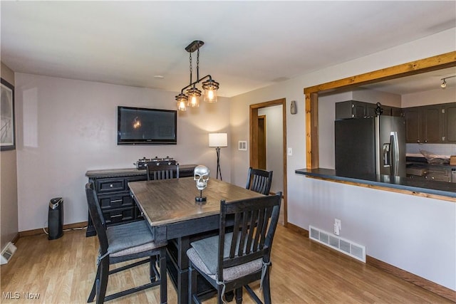 dining area with light hardwood / wood-style flooring