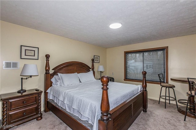 carpeted bedroom with a textured ceiling