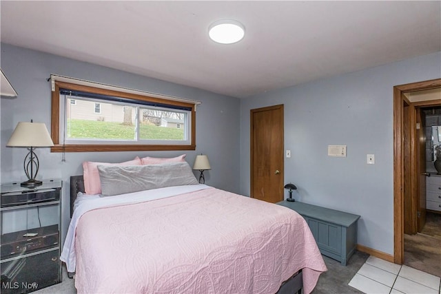 bedroom with light tile patterned flooring