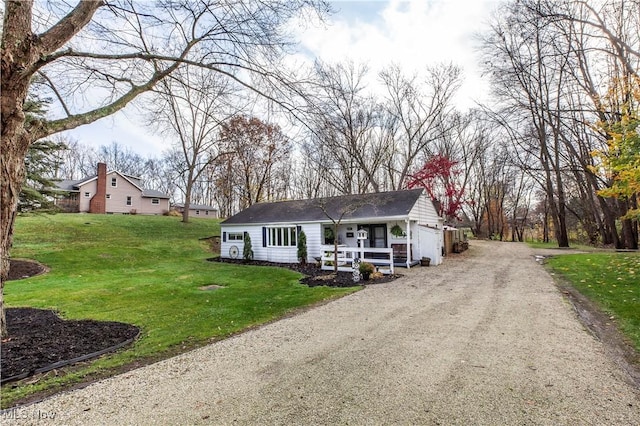 ranch-style home featuring a garage and a front yard