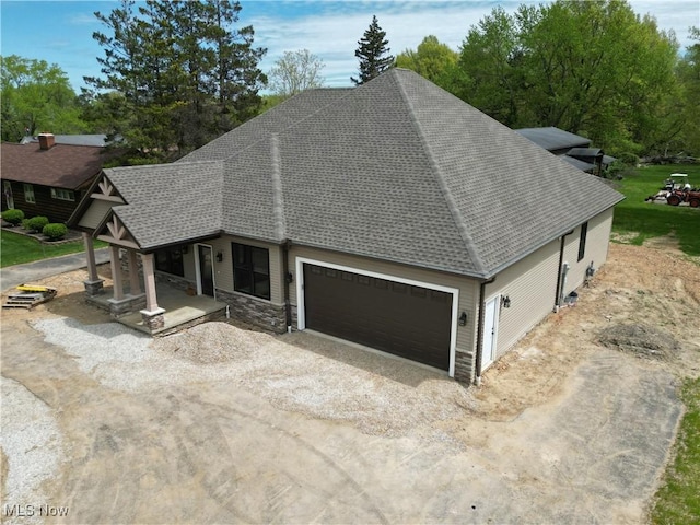 13430 Schreiber Rd, Valley View, OH 44125 - exterior space with covered porch, driveway, a shingled roof, and a garage