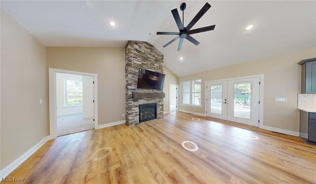 13430 Schreiber Rd, Valley View, OH 44125 - unfurnished living room with a ceiling fan, a wealth of natural light, lofted ceiling, and light wood-type flooring