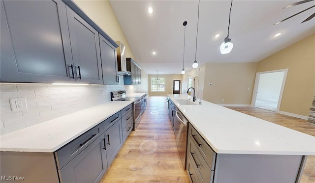 13430 Schreiber Rd, Valley View, OH 44125 - kitchen featuring light wood-type flooring, a sink, appliances with stainless steel finishes, and tasteful backsplash
