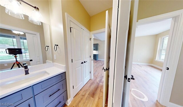 13430 Schreiber Rd, Valley View, OH 44125 - bathroom featuring a wealth of natural light, wood finished floors, and vanity