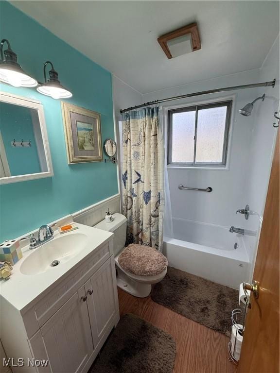 full bathroom with shower / bath combination with curtain, vanity, toilet, and hardwood / wood-style floors