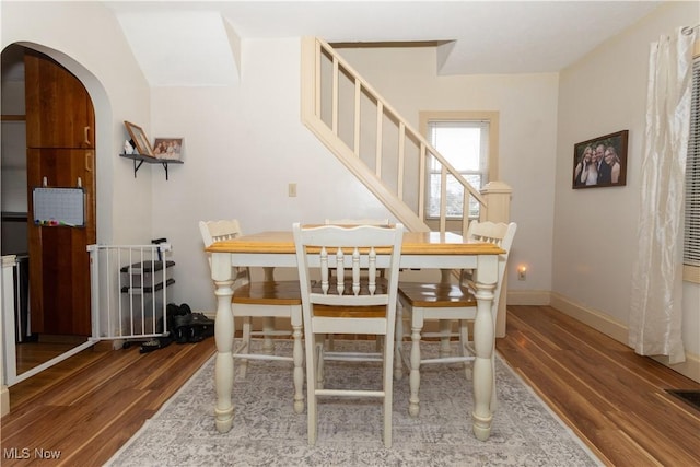 dining space featuring wood-type flooring